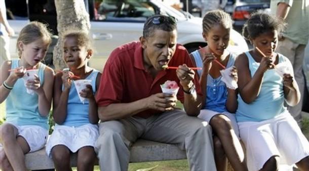 Democratic presidential candidate Sen. Barack Obama, D-Ill., eats shaved ice with his daughters Sasha Obama, 7, second from left, and Malia Obama 10, second from right, and unidentified friends in Kailua, Hawaii on Wednesday, Aug. 13, 2008. Sen. Obama is in Hawaii for a vacation. (AP Photo/Alex Brandon)