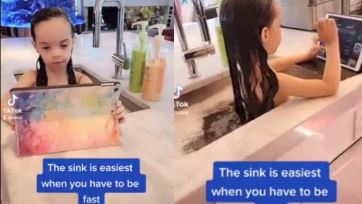 Imagem Mãe é criticada por dar banho na filha de 6 anos na pia da cozinha