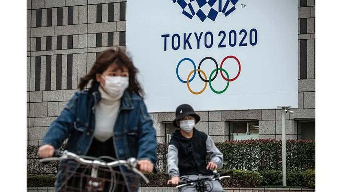 Mulher de mascara em Tókio, Japão - Getty Images