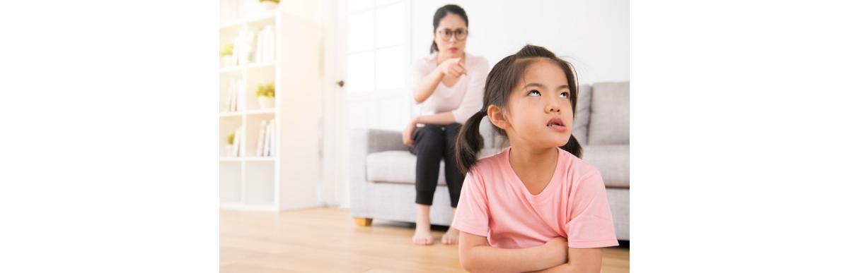 asian-mother-sitting-on-the-sofa-angry-pointing-picture-id835621860